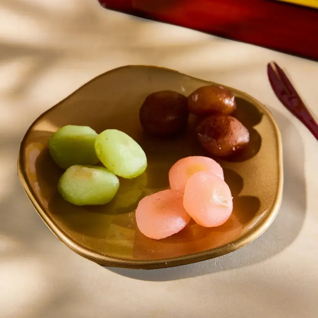 A plate of assorted colorful mochi.